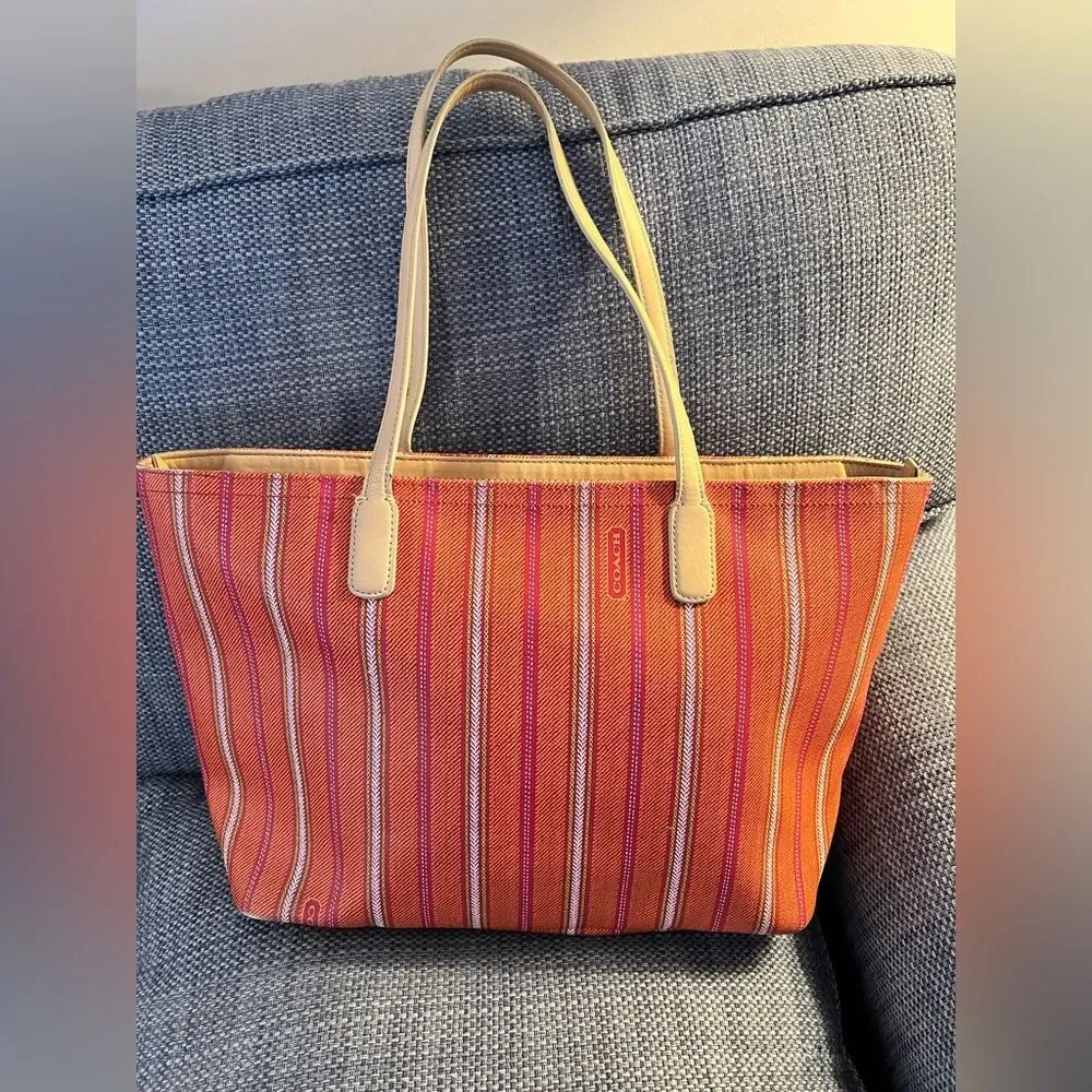 Coach Vintage Striped Orange& Pink Tote Bag with tan leather handles. Zip top,